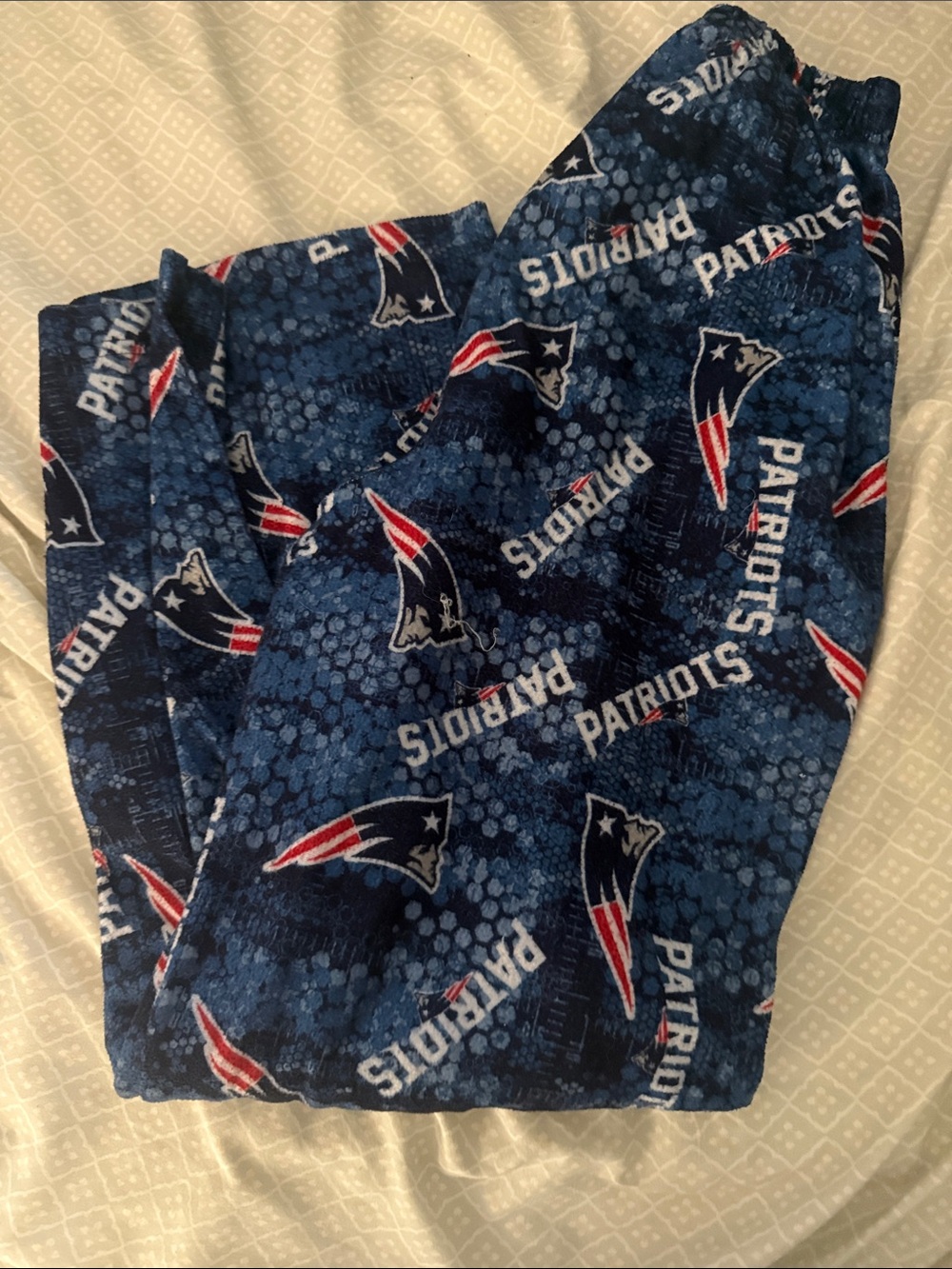 NFL Youth Team Apparel Tag with Red, White, and Blue Logo
